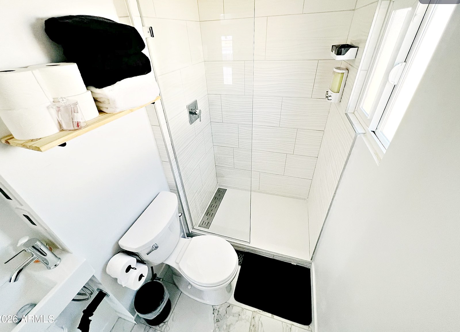 Walk-in tiled shower with window