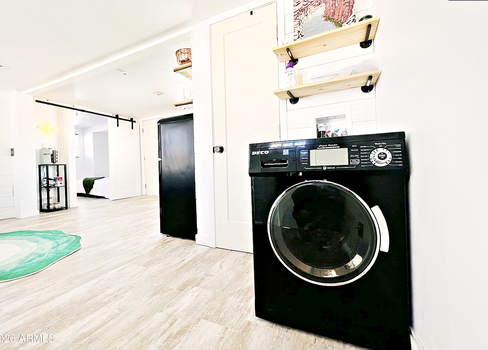 All-in-one washer dryer with farmhouse shelving